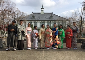 Participants taking pictures on the campus in Japanese outfits