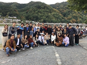 Students with “Togetsu-Kyo” in Arashiyama in the background