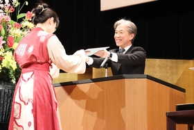 Graduates receiving their diploma